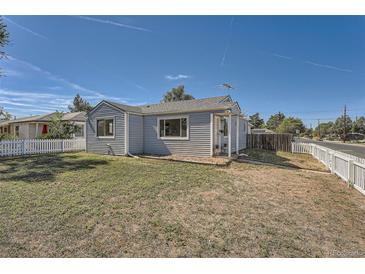 Cute bungalow with a fenced yard at 1289 Newark St, Aurora, CO 80010