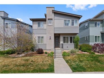 Charming two-story home with modern design, landscaped front yard, and concrete entry steps at 9624 Dunning Cir, Highlands Ranch, CO 80126