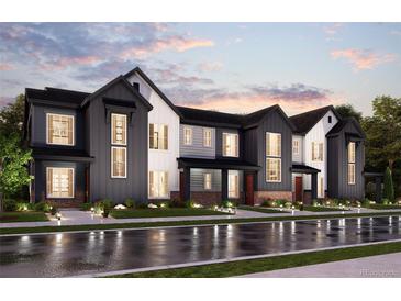 Beautiful townhouse complex showcasing modern architecture and manicured landscaping at 6892 Huddersfield Ln, Castle Pines, CO 80108