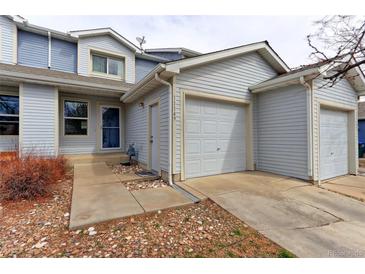 Charming home exterior with a one-car garage, stone landscaping, and a welcoming entrance at 11149 Gaylord St, Northglenn, CO 80233
