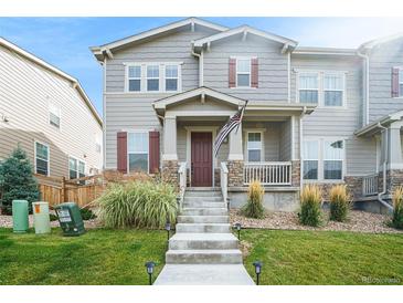 Two-story townhome with front porch and landscaping at 4343 S Nepal Ct, Centennial, CO 80015