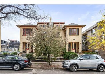 Charming two-story duplex with a classic facade and well-maintained landscaping at 1331 N Ogden St # 1, Denver, CO 80218