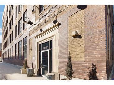 Brick building exterior with large windows and a prominent entrance at 1863 Wazee St # 6E, Denver, CO 80202