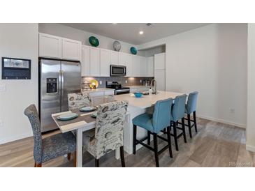 Modern kitchen with stainless steel appliances and an island at 9287 Twenty Mile Rd # 401, Parker, CO 80134