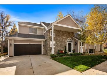 Two-story home with stone accents and a large, attached garage at 107 Fairfield Ln, Louisville, CO 80027