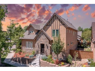 Charming two-story home with stone accents, a landscaped front yard, and an inviting entrance at 507 Ulster Way, Denver, CO 80230