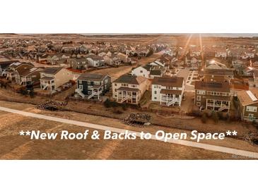 Attractive homes boasting a new roof, solar panels, and back to open space and walking path at 10100 Isle St, Parker, CO 80134