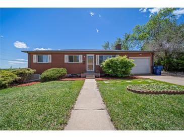 Charming brick ranch home with a well-maintained lawn and mature landscaping in a desirable neighborhood at 12024 W Maryland Dr, Lakewood, CO 80228