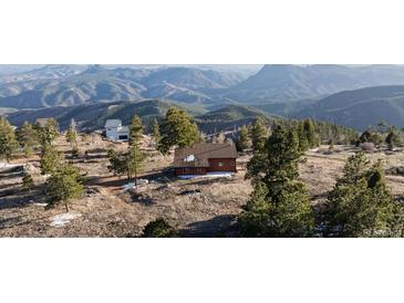 Charming mountain home featuring stunning panoramic views of the surrounding landscape at 18645 Rocky Top Trl, Littleton, CO 80127
