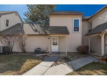 Inviting home with a charming front entrance and well-maintained landscaping at 2101 S Victor St # C, Aurora, CO 80014