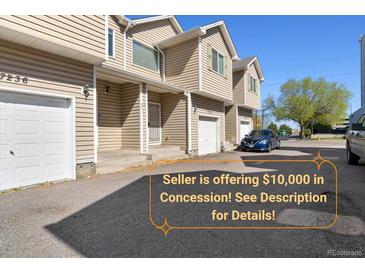 A townhouse complex featuring well-maintained exteriors, private garages and front entries at 7234 E 38Th Ave, Denver, CO 80207