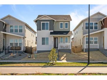 Charming two-story home with a well-manicured lawn and inviting curb appeal at 5936 N Lisbon St, Aurora, CO 80019