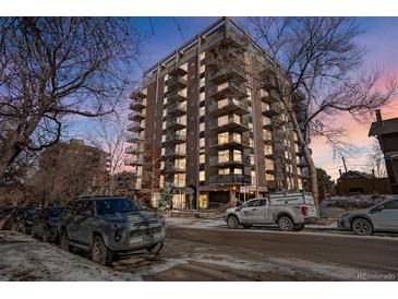 Stunning exterior view of a high-rise building with balconies, complemented by surrounding trees and street at 1150 Vine St # 201, Denver, CO 80206