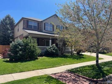Charming two-story home with well-manicured lawn and inviting curb appeal, perfect for families at 176 S Rosemary St, Denver, CO 80230