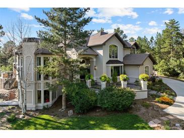 Stunning two-story home with a landscaped yard and a beautiful stone exterior at 918 Dakota Dr, Castle Rock, CO 80108