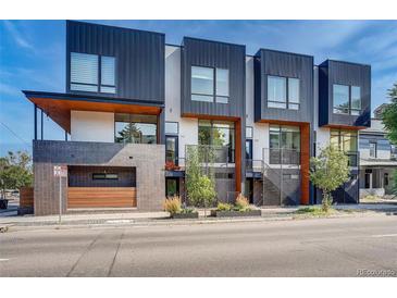 Modern three-unit townhome development with sleek design and private entrances at 903 E 13Th Ave, Denver, CO 80218