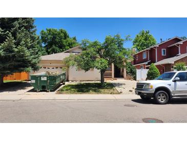 Charming single-Gathering home with a well-maintained front yard and a cozy porch at 756 Brookside Dr, Longmont, CO 80504