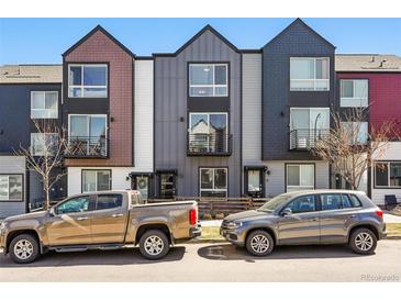 Street view of modern townhomes with unique architectural details and a mix of exterior finishes at 1064 Depew St, Lakewood, CO 80214