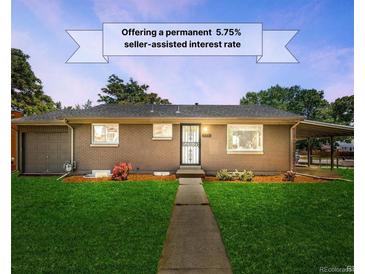 Charming single-story home featuring a lush green lawn, inviting walkway, and seller assisted interest rate at 4300 Osage St, Denver, CO 80211