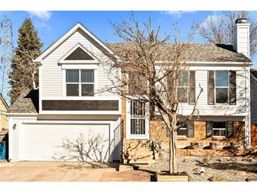 Two story house with a gray exterior and a two car garage at 19573 E Linvale Dr, Aurora, CO 80013