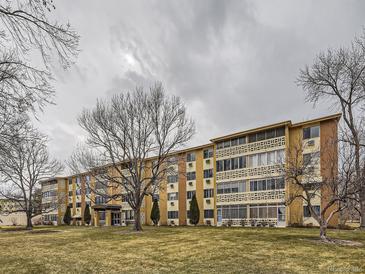 Spacious multi-Gathering unit featuring a charming, well-maintained lawn, and welcoming entrance at 625 S Alton Way # 3D, Denver, CO 80247