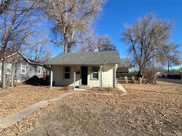 Charming bungalow with a spacious front yard at 504 Quitman St, Denver, CO 80204