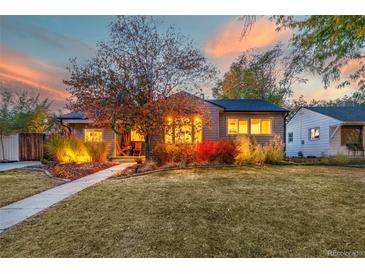 Charming craftsman home with landscaped yard and walkway at 5123 Bryant St, Denver, CO 80221