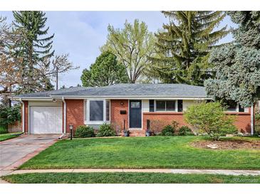 Charming single-story brick home featuring a well-manicured lawn and mature trees at 6587 S Clarkson St, Centennial, CO 80121