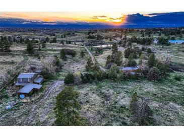 Expansive aerial view showcasing the rolling landscape and picturesque setting at 10426 Tomahawk Rd, Parker, CO 80138
