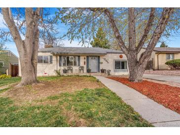 Charming single-story home with a well-maintained front yard, sidewalk and mature trees at 2756 S Linley Ct, Denver, CO 80236