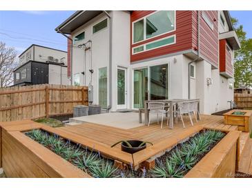 An outdoor deck features built-in planters and outdoor seating at 4390 Osage St, Denver, CO 80211