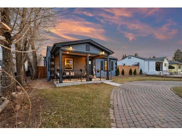 Charming single-Gathering home features a welcoming porch with outdoor seating and well-maintained landscaping at 4510 W 4Th Ave, Denver, CO 80219