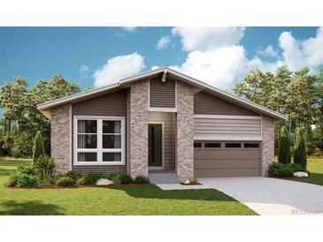 Charming single-story home with a modern design, featuring a brick facade and an attached garage at 1371 Lumber Ridge N Cir, Erie, CO 80516