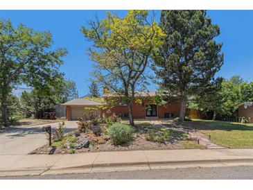 Charming brick home with well-maintained front yard and lush landscaping at 15 Pawnee Dr, Boulder, CO 80303
