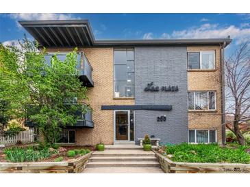 Lee Plaza apartment building with well-maintained landscaping and balconies at 200 N Sherman St # 7, Denver, CO 80203