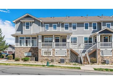 Inviting townhouse with stone accents and a private entrance at 9351 Amison Cir # 104, Parker, CO 80134