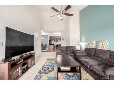 Comfortable living room featuring a ceiling fan and cozy furniture at 804 Summer Hawk Dr # 303, Longmont, CO 80504