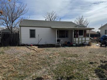 View of the home and backyard, showing the backyard and exterior features of the property at 7080 Cherry St, Commerce City, CO 80022