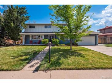 Charming two-story home with a well-manicured lawn and inviting front porch at 6726 S Franklin St, Centennial, CO 80122