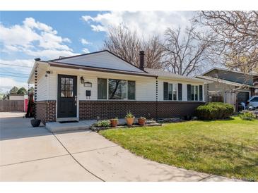 Charming single-story home with a well-maintained lawn and brick accents at 3310 W 95Th Ave, Westminster, CO 80031