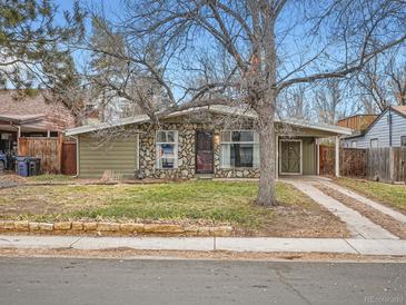 Ranch style home with stone facade and landscaping at 5619 E Minnesota Dr, Denver, CO 80224