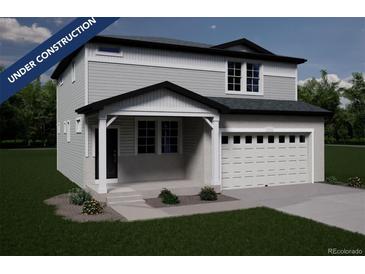 New two-story home with attached two-car garage and covered porch, in the process of being built at 3908 N Riviera Ct, Aurora, CO 80019