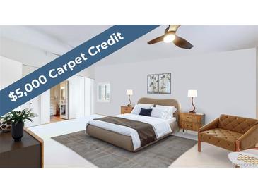 Cozy bedroom featuring a plush bed, stylish furnishings, and a $5,000 carpet credit at 775 S Alton Way # 3D, Denver, CO 80247