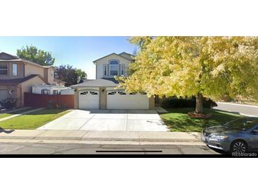 Charming two-story home with a three-car garage and well-maintained front yard at 12135 Elizabeth St, Thornton, CO 80241