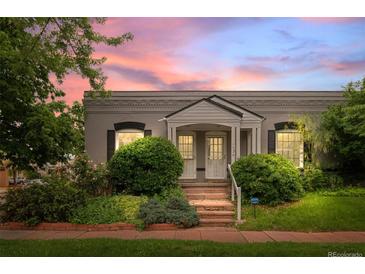 Charming home with well-maintained landscaping and a cozy entrance, evoking a sense of warmth and curb appeal at 1038 E 4Th Ave, Denver, CO 80218
