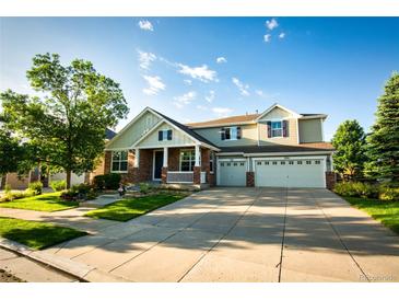 Charming two-story home with a three car garage and a well-manicured front yard at 2861 Eagle Cir, Erie, CO 80516