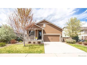 Charming single-Gathering home with well-maintained lawn, two-car garage, and cozy covered porch at 1358 14Th Ave, Longmont, CO 80501