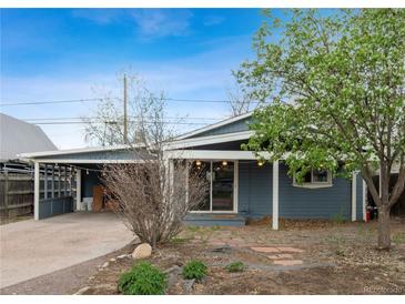 Charming single-story home with a covered parking area and a well-kept front yard in a tranquil neighborhood at 2125 S Gilpin St, Denver, CO 80210
