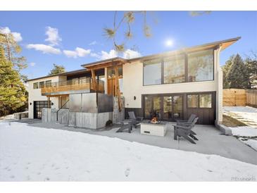 Stunning contemporary home with expansive windows and a fire pit at 14800 Foothill Rd, Golden, CO 80401