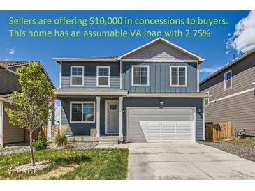 Charming two-story home with a well-maintained lawn and attached two car garage at 2417 Mountain Sky Dr, Fort Lupton, CO 80621